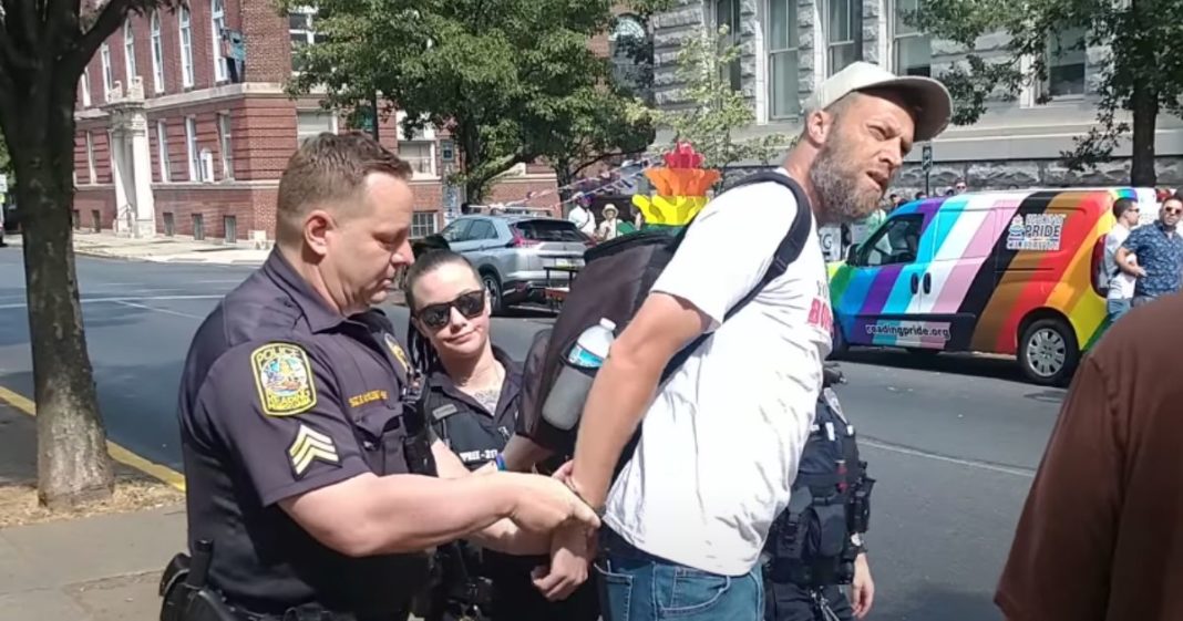 Christian Arrested After Holding Sign with 7 Biblical Words on It at 'Pride' Event: Report