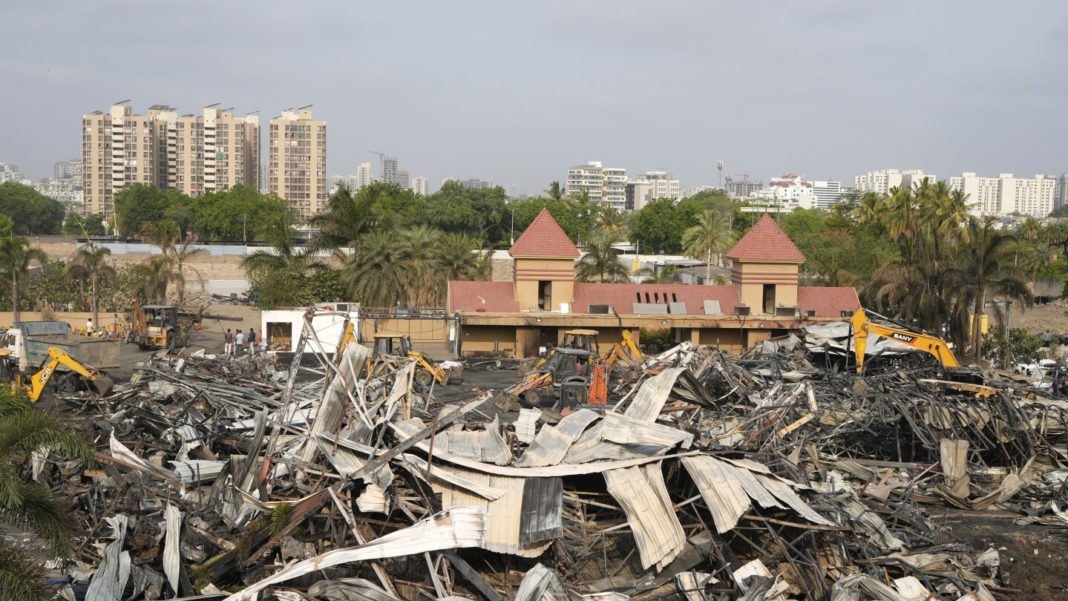 Bodies of 27 'burnt beyond recognition' after a massive fire in Indian amusement park, relatives say