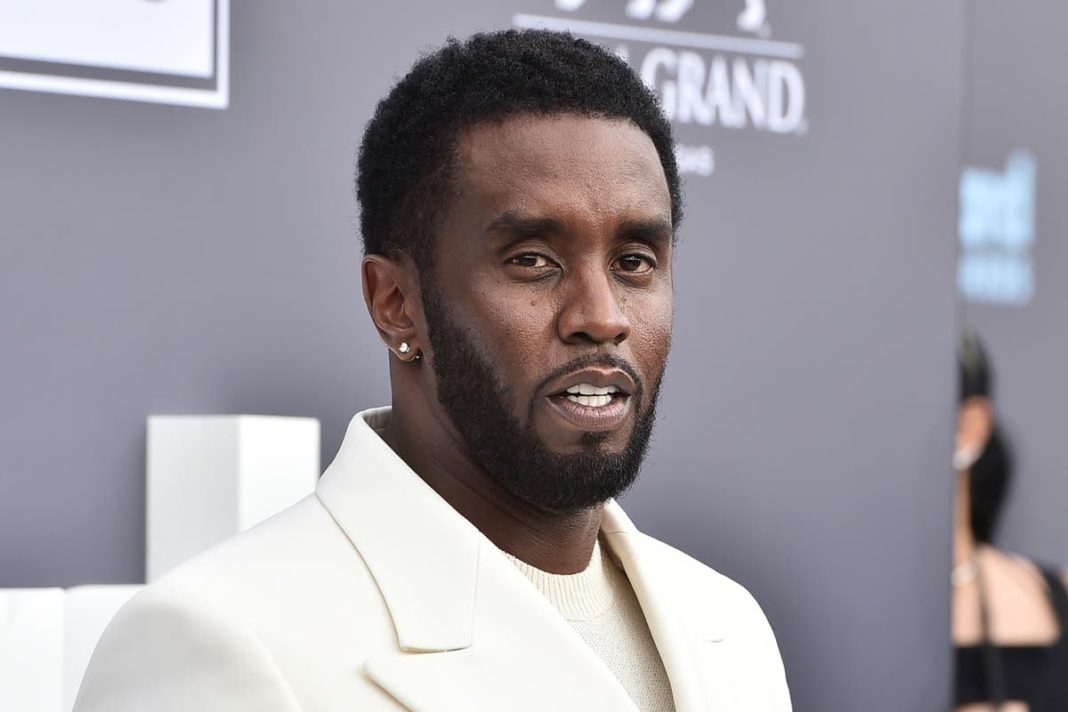 Diddy seen in shocking video punching and kicking girlfriend Cassie in hotel hallway