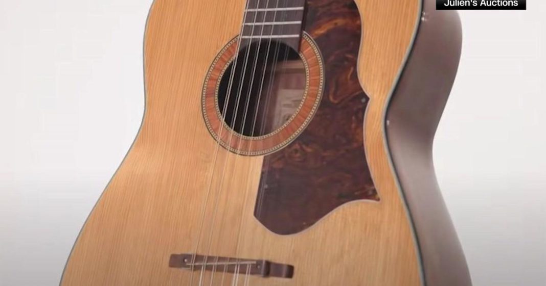 John Lennon's guitar, lost for 50 years, sells for record $2.85 million