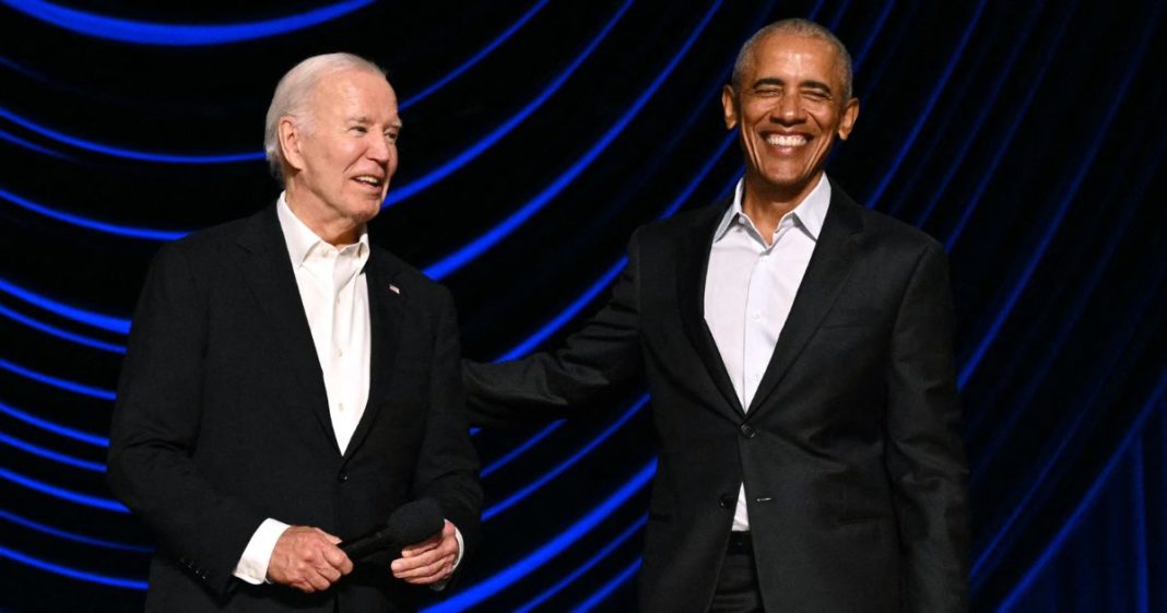 President Joe Biden laughs with former President Barack Obama onstage during a campaign fundraiser at the Peacock Theater in Los Angeles on Saturday.