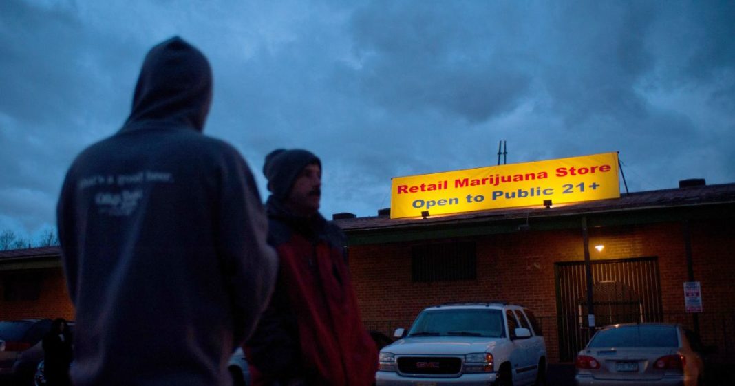 A sign is displayed outside the 3-D Denver Discrete Dispensary on January 1, 2014 in Denver, Colorado.