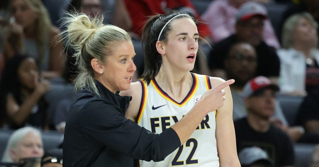 Indiana Fever coach Christie Sides talks to star rookie Caitlin Clark during a game against the Las Vegas Aces at Michelob Ultra Arena in Las Vegas on May 25.