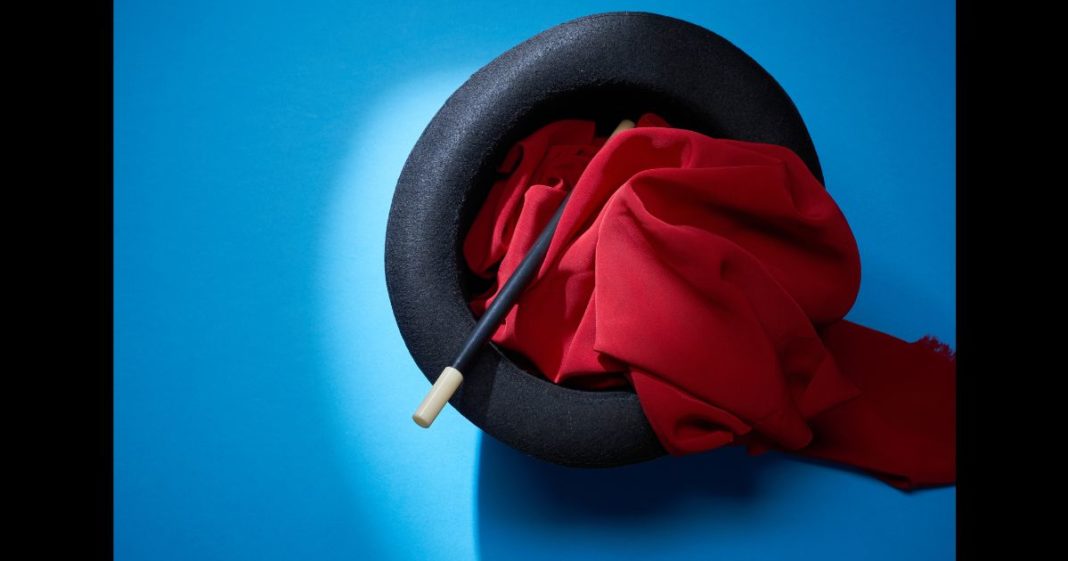 This Getty stock image shows a magician's wand and scarf in a hat.