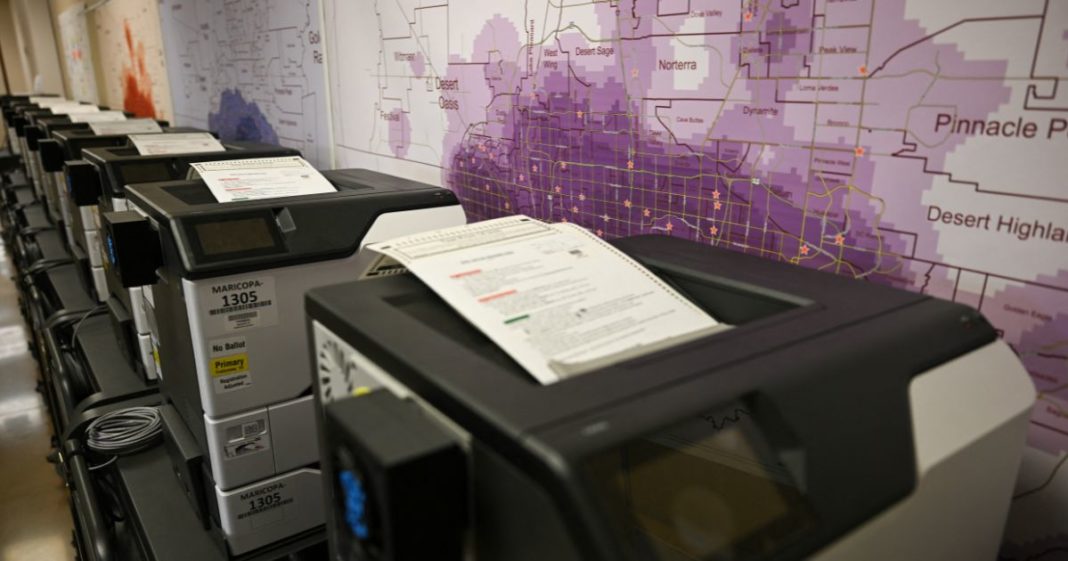 Ballot printers for in-person voting are loaded with test ballots in storage at the Maricopa County Tabulation and Election Center ahead of this year's Arizona primary and general elections in Phoenix on June 3.