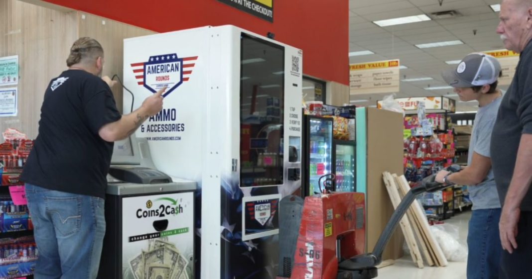 An ammunition dispenser being installed in a grocery store.