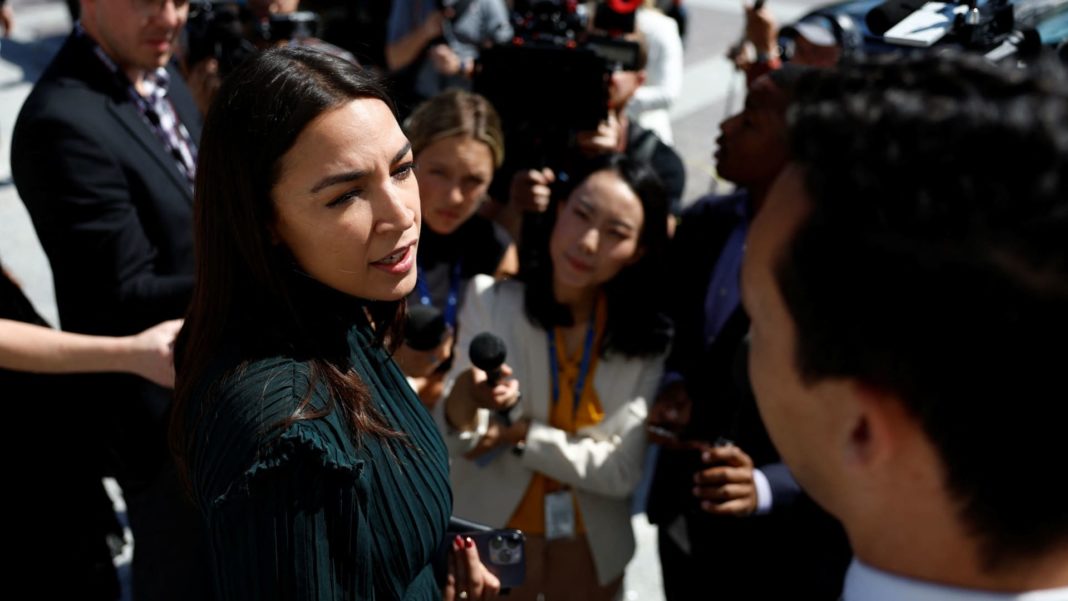 AOC rallies to Biden's side as progressives split over backing his 2024 campaign