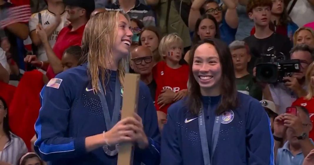 This X screen shot shows Torri Huske (R) and Gretchen Walsh (L), who took home gold and silver, respectively, in the women's 100 meter fly event on July 28, 2024.