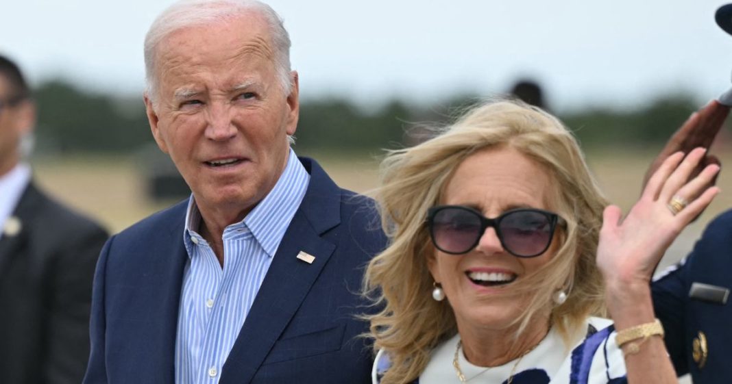 First lady Jill Biden, right, waves after stepping off Air Force One upon arrival at Francis S. Gabreski Airport in Westhampton Beach, New York, on Saturday.