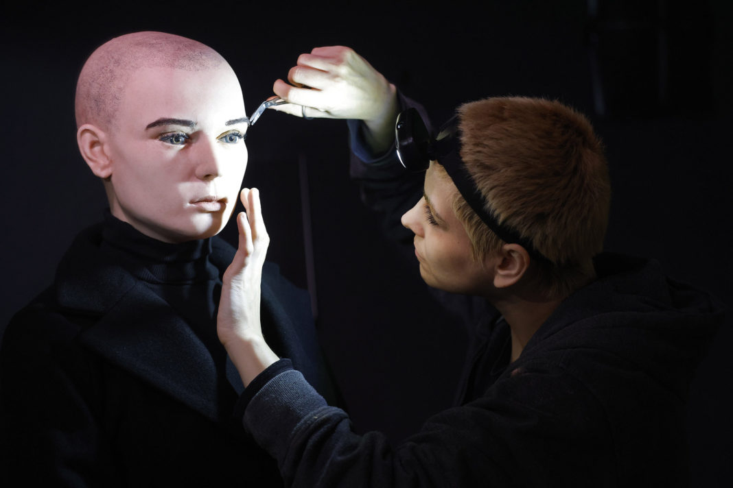 In this undated handout photo provided by The National Wax Museum Plus, Artistic Coordinator Mel Creek applies the finishing touches on a wax figure of the late singer Sinead O'Connor, at the National Wax Museum Plus in Dublin, Ireland.