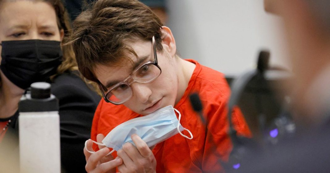 Marjory Stoneman Douglas High School shooter Nikolas Cruz puts his mask back on during a hearing regarding possible jury misconduct in the deliberations of Nikolas Cruz at the Broward County Courthouse in Fort Lauderdale, Florida, on Oct. 14, 2022.