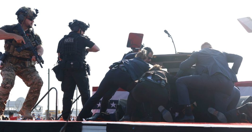 Republican presidential candidate former President Donald Trump is rushed offstage during a rally Saturday in Butler, Pennsylvania. Trump and two audience members were wounded and an audience member was killed in the shooting .