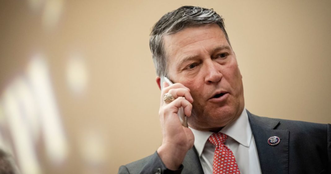 U.S. Rep. Ronny Jackson (R-TX) takes a phone call during the America First Agenda Summit, at the Marriott Marquis Hotel on July 26, 2022 in Washington, DC.