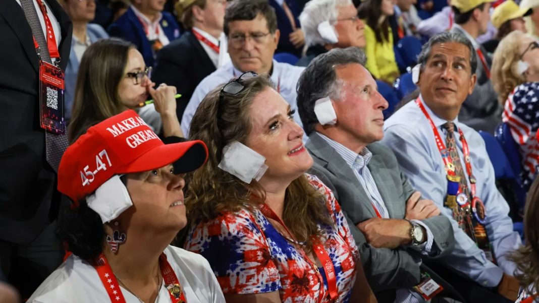 Republican supporters wear fake ear bandages 'in solidarity' with Trump at Milwaukee convention