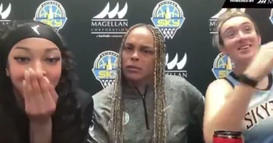 Chicago Sky players Angel Reese, left, and Marina Mabrey, right, and coach Teresa Weatherspoon react to a reporters hot mic moment during a Sunday interview.