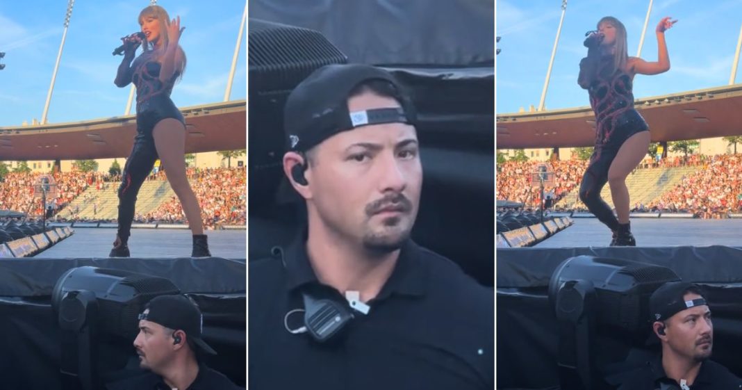 A bodyguard keeps an eye out during Taylor Swift's concert in Zurich on July 10.