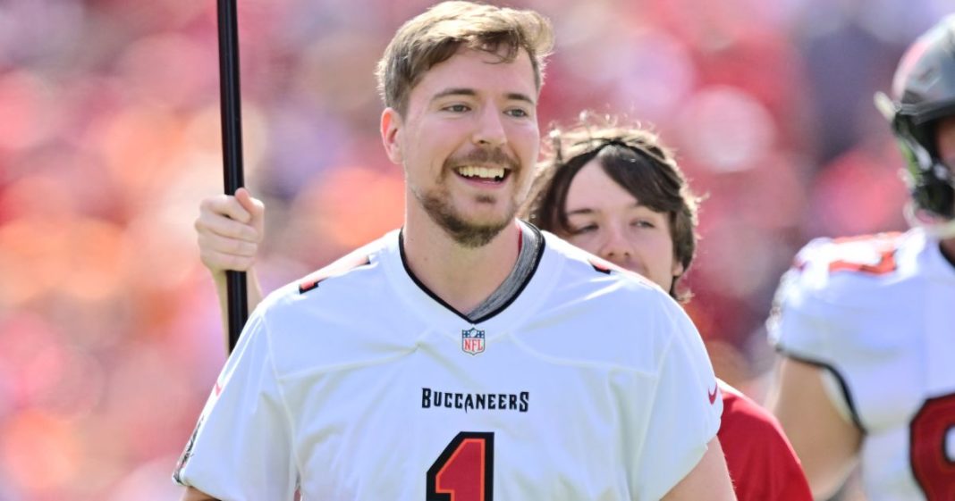 YouTube personality MrBeast runs on to the field prior to a game between the Tampa Bay Buccaneers and the Atlanta Falcons in Tampa, Florida, on Oct. 22, 2023.