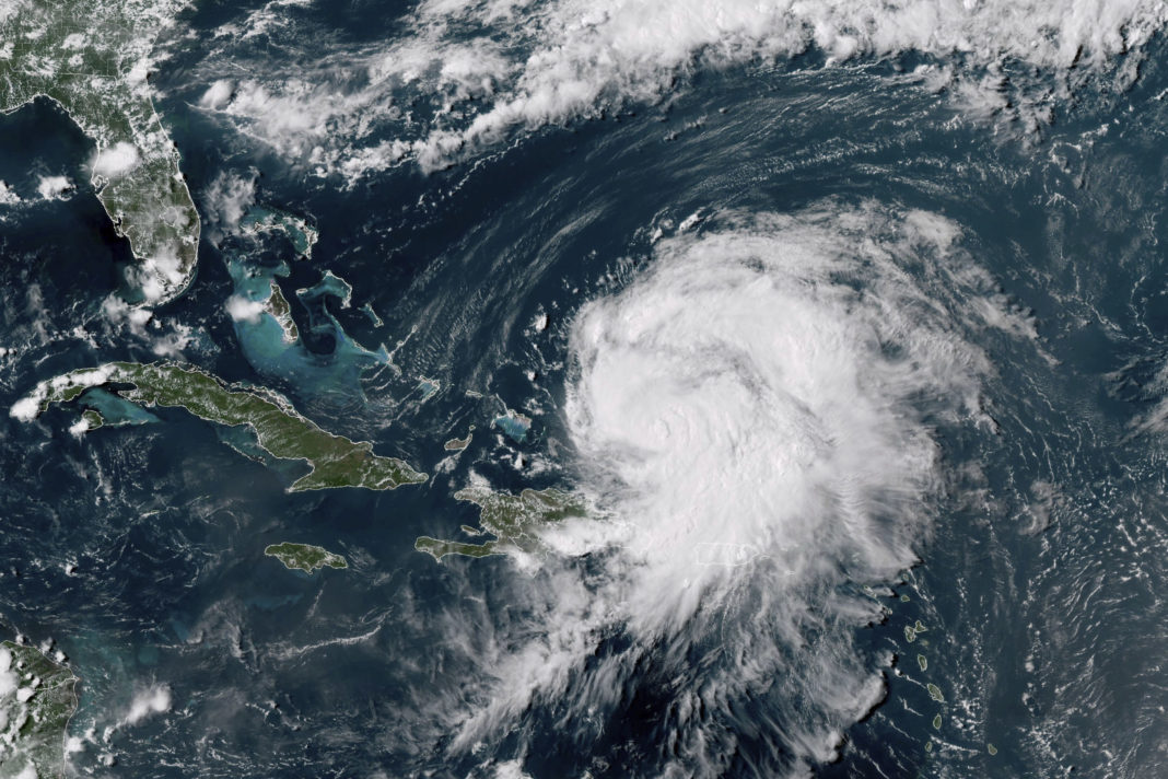 This GOES-16 GeoColor satellite image taken at 4 p.m EDT and provided by National Oceanic and Atmospheric Administration (NOAA) shows Hurricane Ernesto northwest of San Juan, Puerto Rico and moving over open waters on Wednesday.