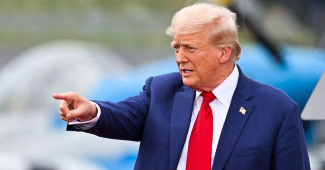 Former President and Republican presidential candidate Donald Trump points while speaking during a campaign rally Wednesday in Asheboro, North Carolina.