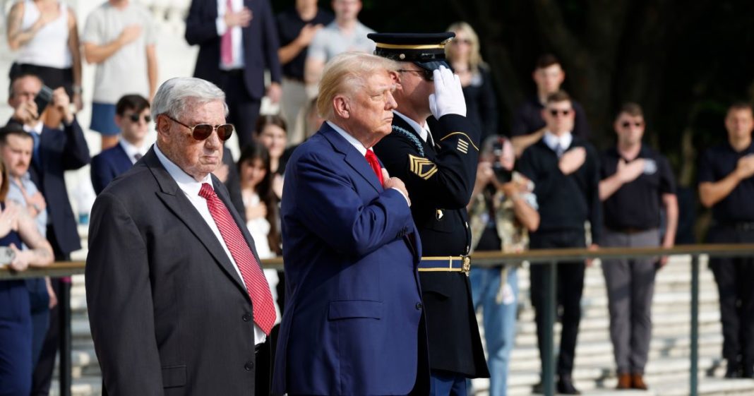 Republican presidential nominee, former U.S. President Donald Trump stands alongside Bill Barnett (L), who's grandson Staff Sgt Darin Taylor Hoover died in Abbey Gate Bombing, during a wreath laying ceremony at the Tomb of the Unknown Soldier at Arlington National Cemetery on August 26, 2024 in Arlington, Virginia.