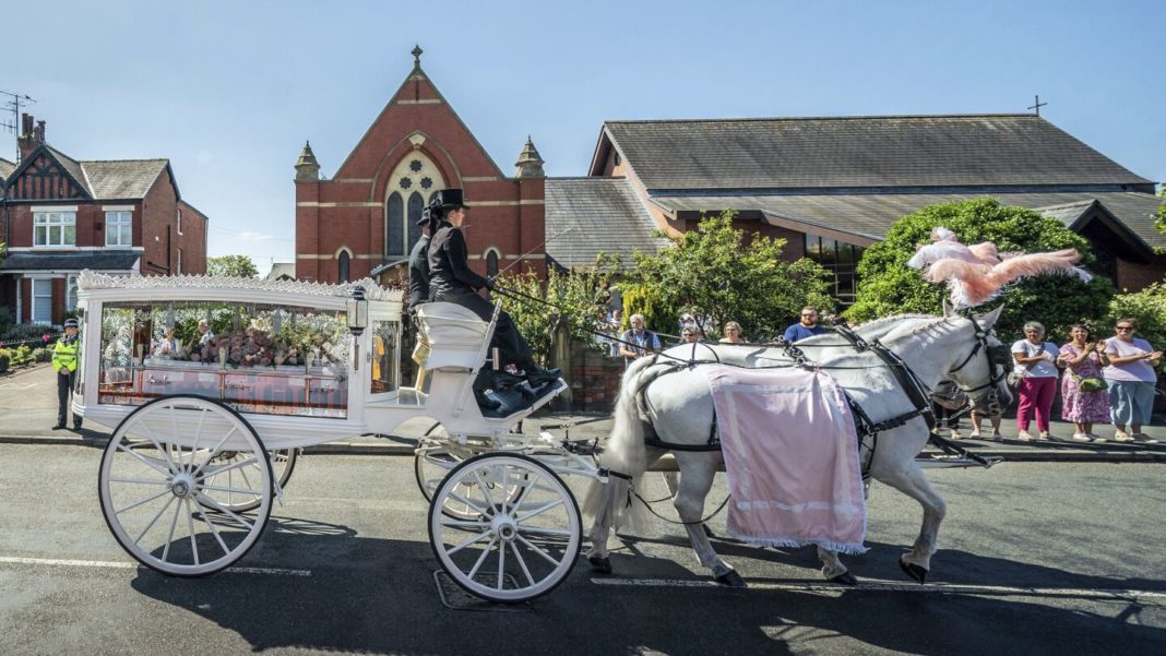 English town of Southport mourns 9-year-old stabbing victim and calls for an end to unrest