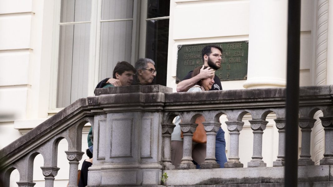 Families of Brazilian plane crash victims gather in Sao Paulo as experts work to identify the dead