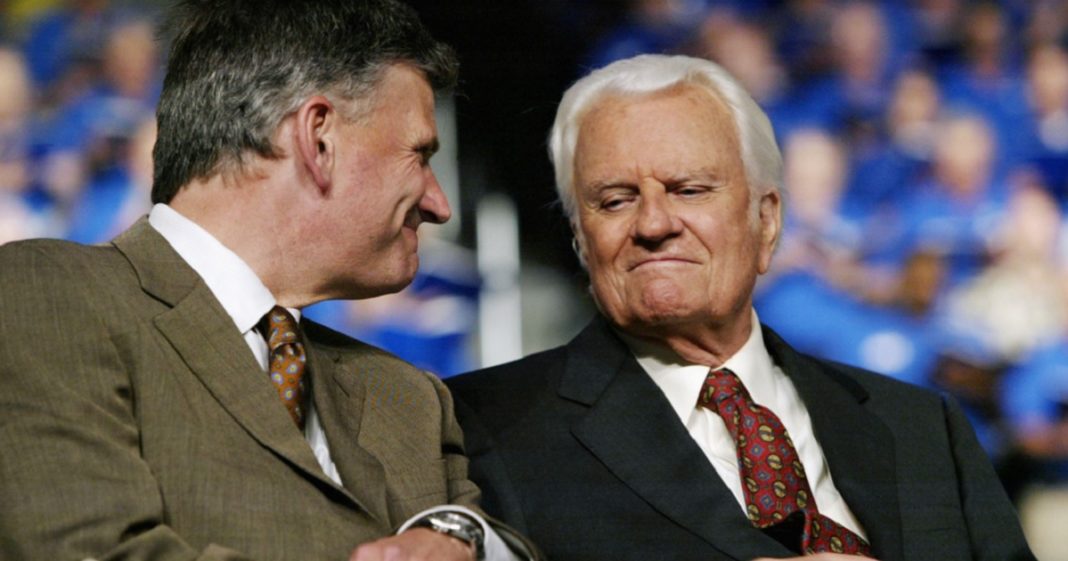 Father and son evangelists Franklin Graham and the late Billy Graham are pictured in a 2003 file photo in Oklahoma City, Oklahoma.