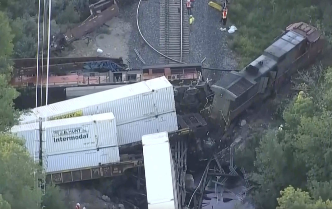 Investigators work the scene on Friday, where two freight trains collided and derailed in Boulder, Colorado, on Thursday night.