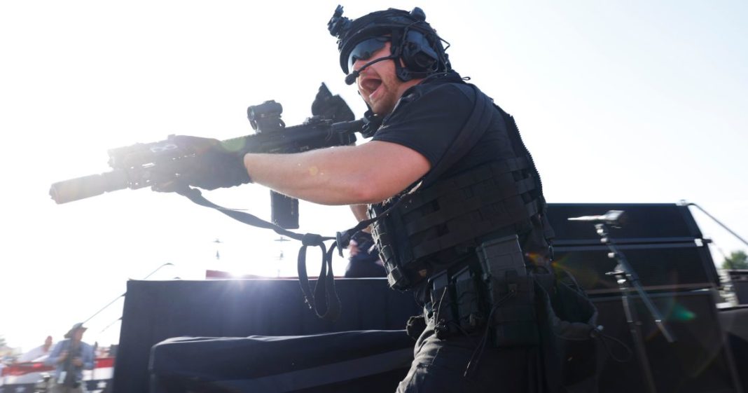 A law enforcement officer reacts after shots were fired at a rally for former President Donald Trump in Butler, Pennsylvania, on July 13.