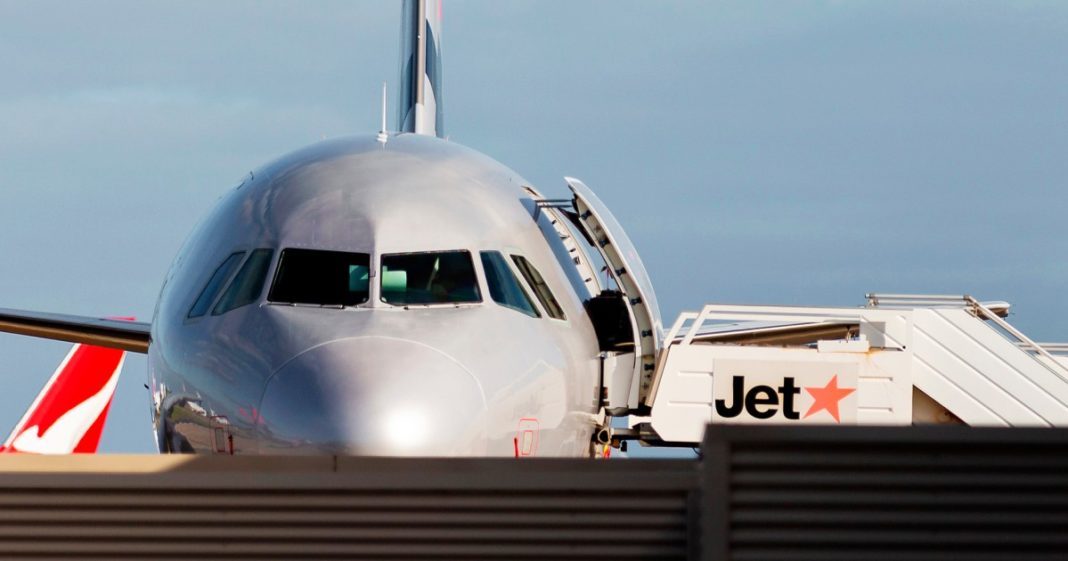 Man arrested at airport after opening plane door and walking on wing