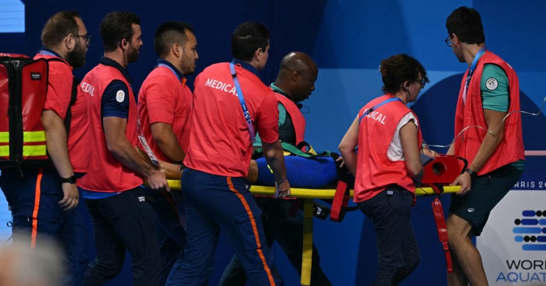 Slovakian swimmer Tamara Potocka is carried out on a stretcher after she collapsed following a heat of the women's 200-meter individual medley swimming event during the Paris 2024 Olympic Games in Nanterre, France, on Friday.