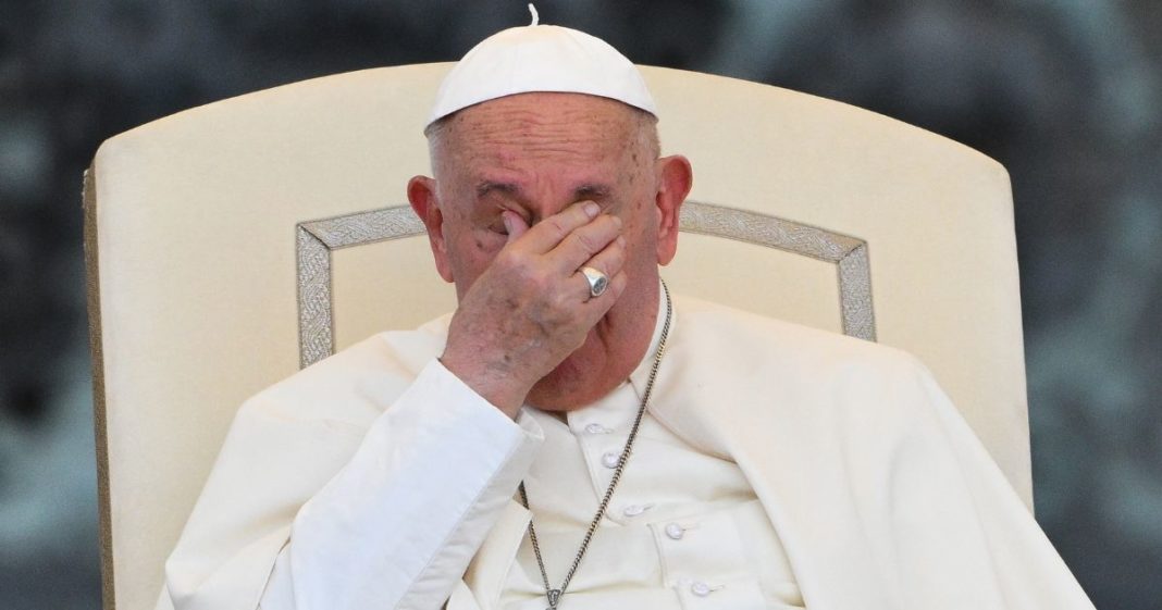 Pope Francis wipes his eyes during the open-air audience of XIII International Pilgrimage of Altar Servers at St. Peter's square in the Vatican on Tuesday.