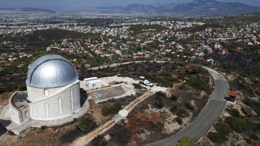 AP PHOTOS: A ferocious blaze scars the land outside Greece’s capital