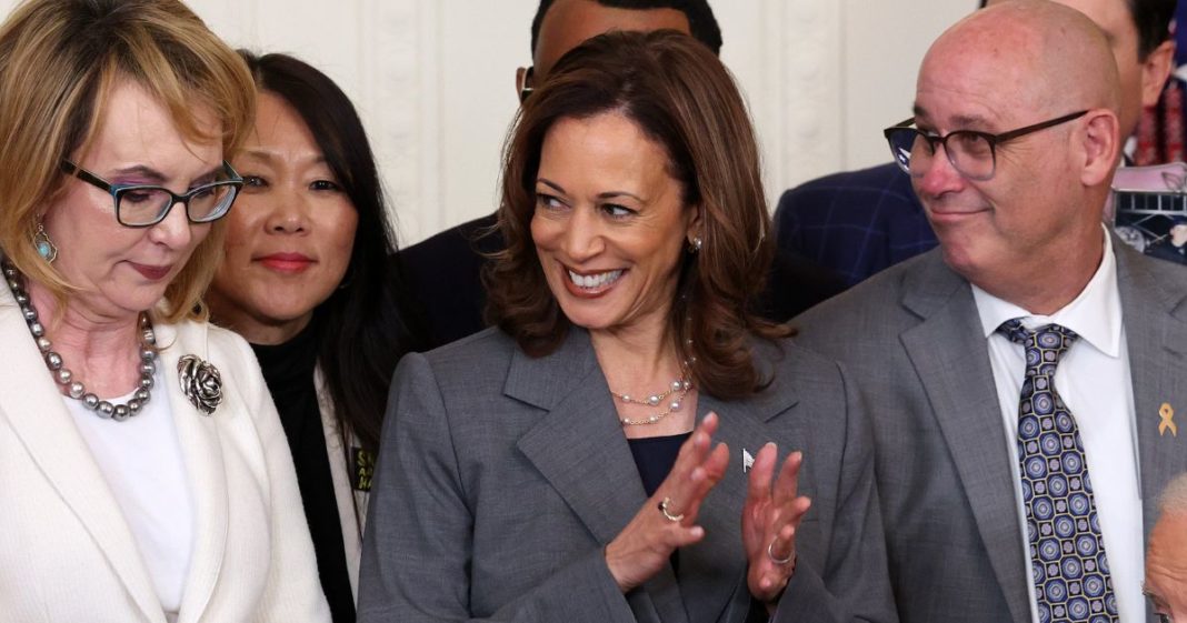 U.S. President Joe Biden hands a pen to Rep. Lucy McBath, who lost her son, Jordan Russell Davis, to gun violence in 2012, after signing an executive order that included gun-related legislation, including the creation of a task force to assess the threat of machine gun conversion devices, during an event in the East Room of the White House September 26, 2024 in Washington, DC.