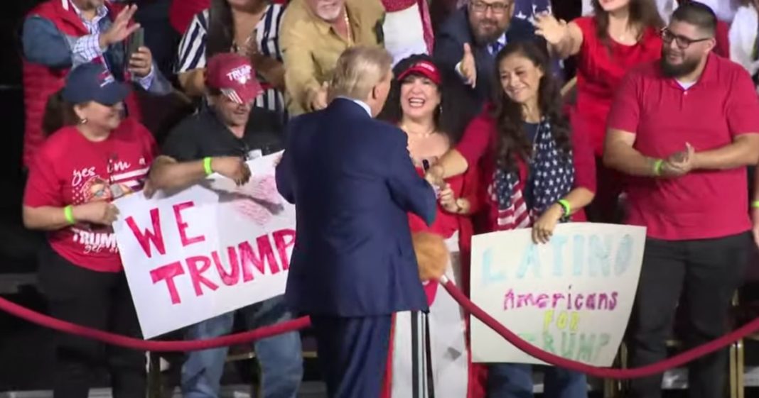 Former President Donald Trump, center, shakes hands with supporters at a campaign rally in Tucson, Arizona, on Sept. 12.