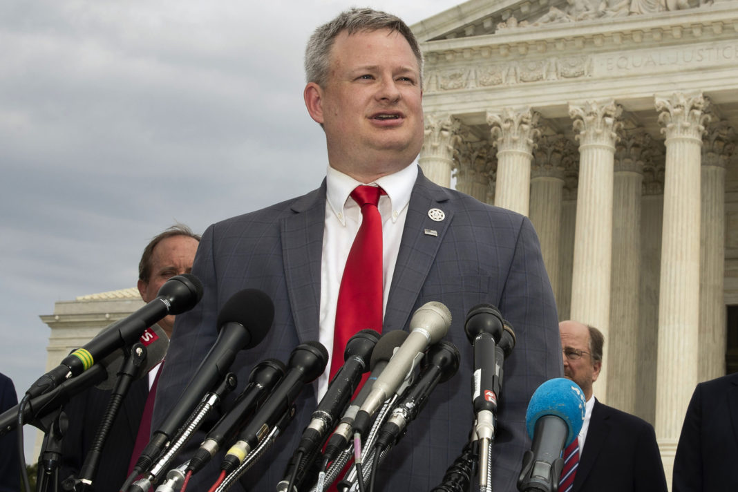 South Dakota Attorney General Jason Ravnsborg speaks to reporters in front of the U.S. Supreme Court in Washington on Sept. 9, 2019.