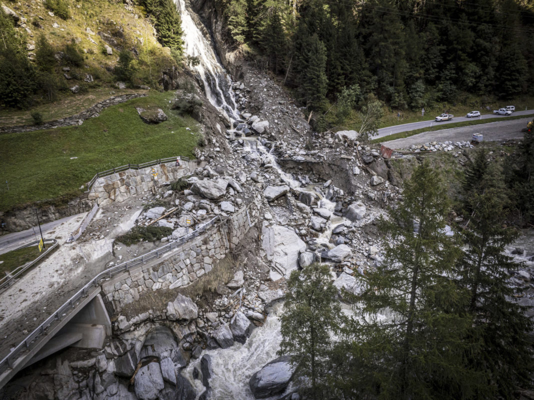 A road is blocked in Eisten, Switzerland on Friday after a landslide following severe weather.