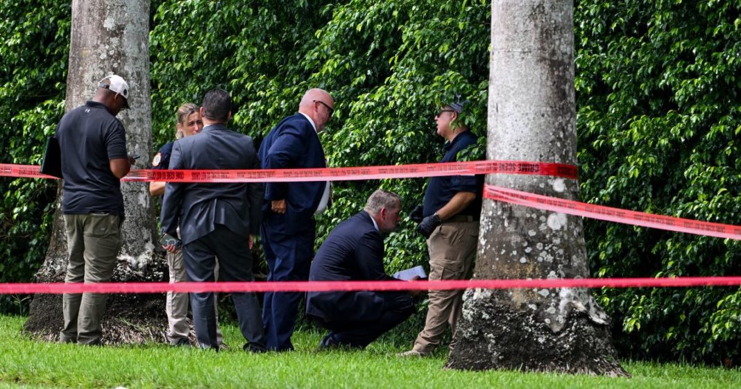 Law enforcement officials work at the crime scene outside the Trump International Golf Club in West Palm Beach, Florida, on Monday.