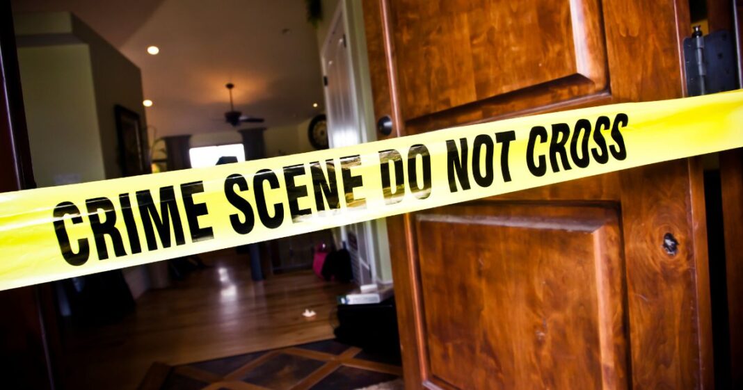 This Getty stock image shows yellow police tape in front of a crime scene.