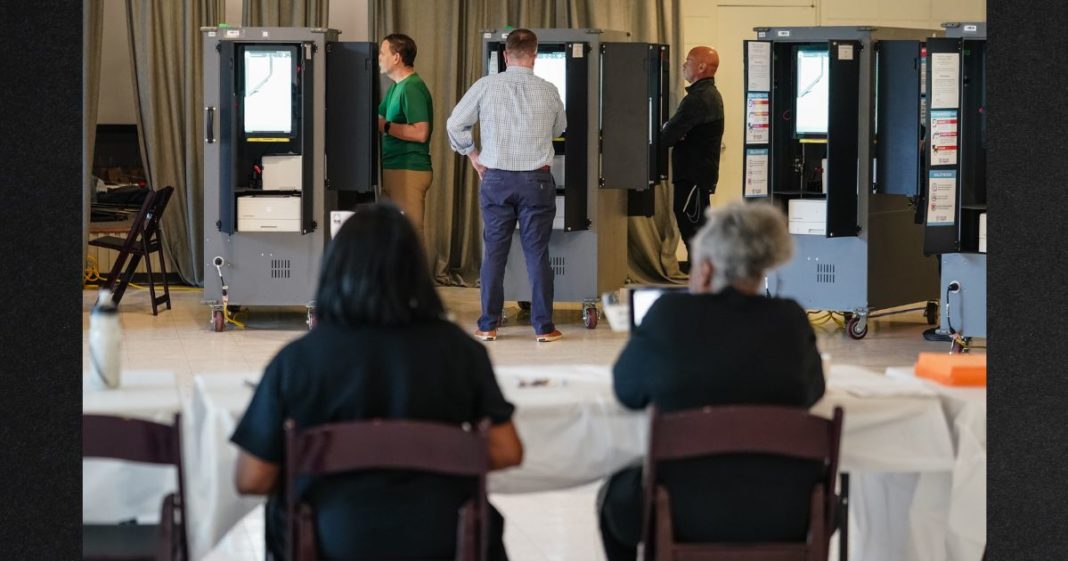 Voters cast ballots in Georgia's primary election at a polling location on May 21, 2024, in Atlanta, Georgia