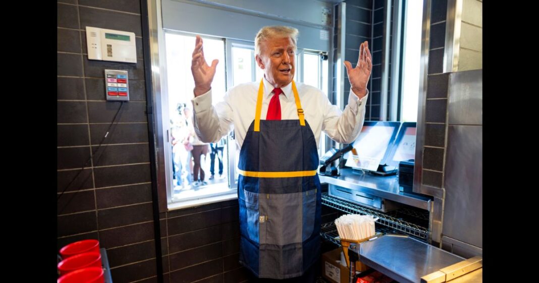 Republican presidential nominee, former U.S. President Donald Trump works behind the counter during a campaign event at McDonald's restaurant on October 20, 2024 in Feasterville-Trevose, Pennsylvania.