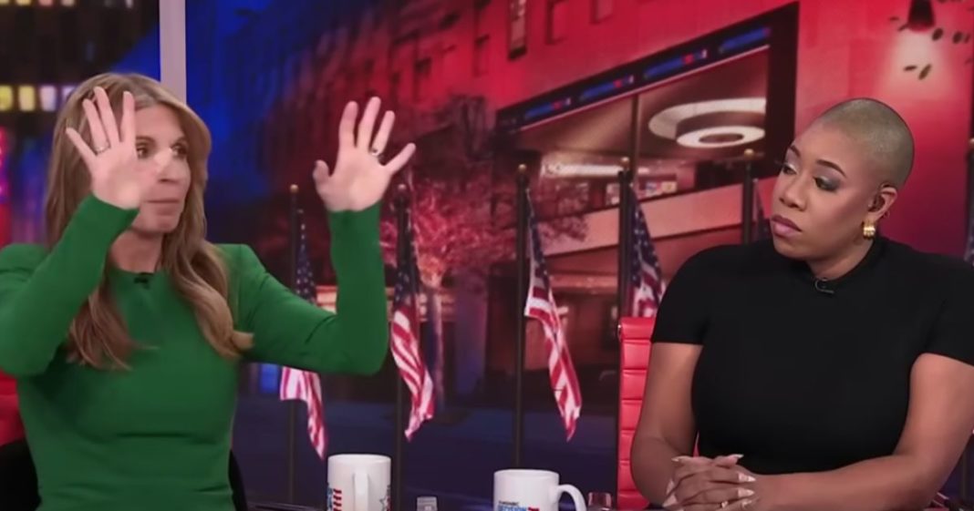 MSNBC panelist Nicolle Wallace, left, goes off after the vice presidential debate on Tuesday as fellow panelist Symone Sanders, right, listens.