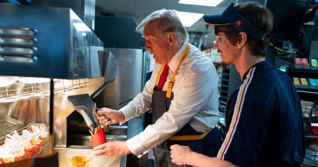 Former President Donald Trump works behind the counter during a campaign event at a McDonald's in Feasterville-Trevose, Pennsylvania, on Sunday.