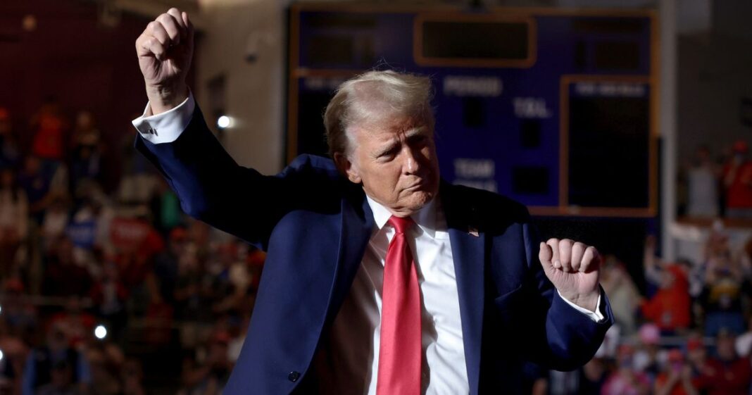 Former President Donald Trump dances while entering a campaign rally in Greenville, North Carolina, on Monday.