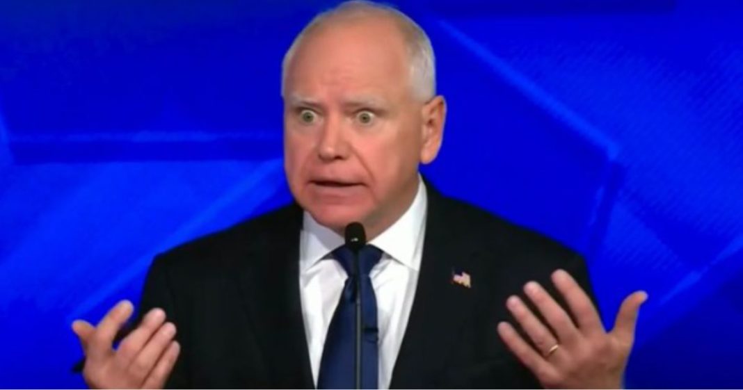 Gov. Tim Walz reacts during the vice presidential debate against Sen. J.D. Vance on Tuesday in New York City.