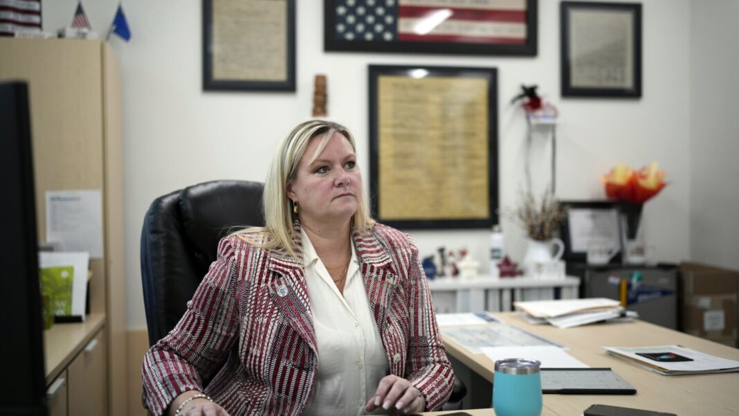 The top election official in a politically crucial Nevada county says she was forced out