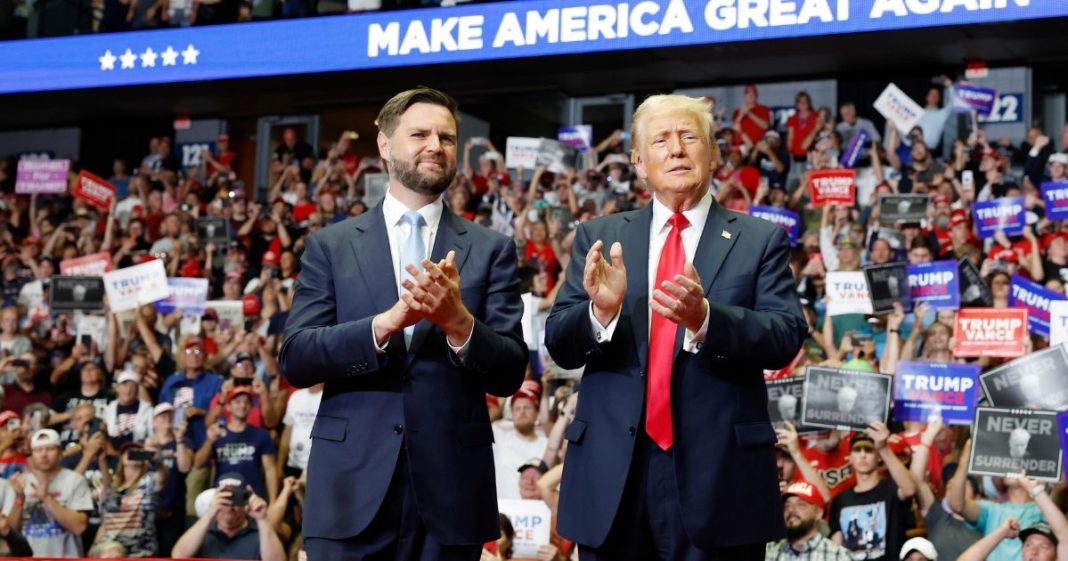 Republican presidential nominee, former U.S. President Donald Trump stands onstage with Republican vice presidential candidate, Sen. J.D. Vance (R-OH) during a campaign rally at the Van Andel Arena on July 20, 2024 in Grand Rapids, Michigan.