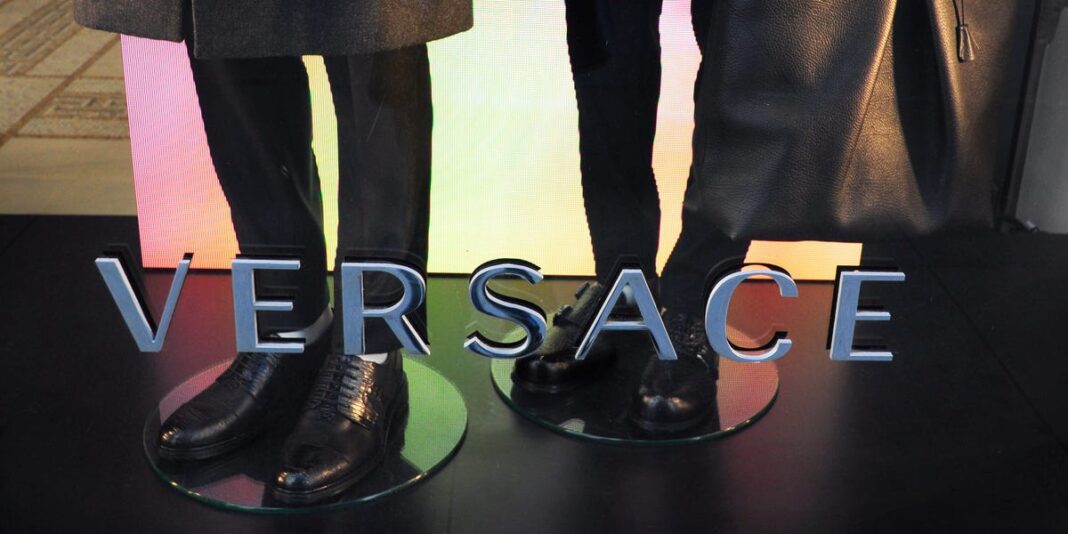 Versace's parent company stock plunged 45% after an affordable-luxury deal was blocked in court