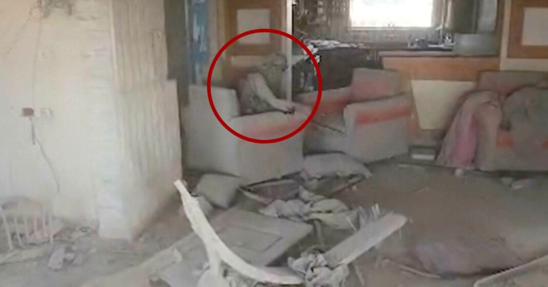 Video provided by the Israel Defense Force shows a heavily damaged building with a person the Israeli military identified as Hamas leader Yahya Sinwar seated in a chair in Rafah, Gaza Strip, on Wednesday.