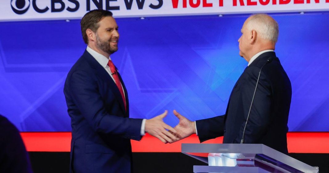 Democratic vice presidential candidate Minnesota Gov. Tim Walz and Republican vice presidential candidate Sen. JD Vance (R-OH) shake hands after a debate at the CBS Broadcast Center on October 1, 2024 in New York City.